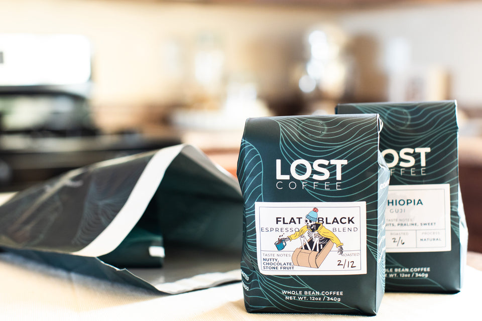 Lost Coffee's coffee subscription that is pulled out of a shipping bag coming from Colorado. 