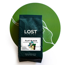 Load image into Gallery viewer, Flat Black Espresso Blend in a green bag, a natural and washed process whole bean
